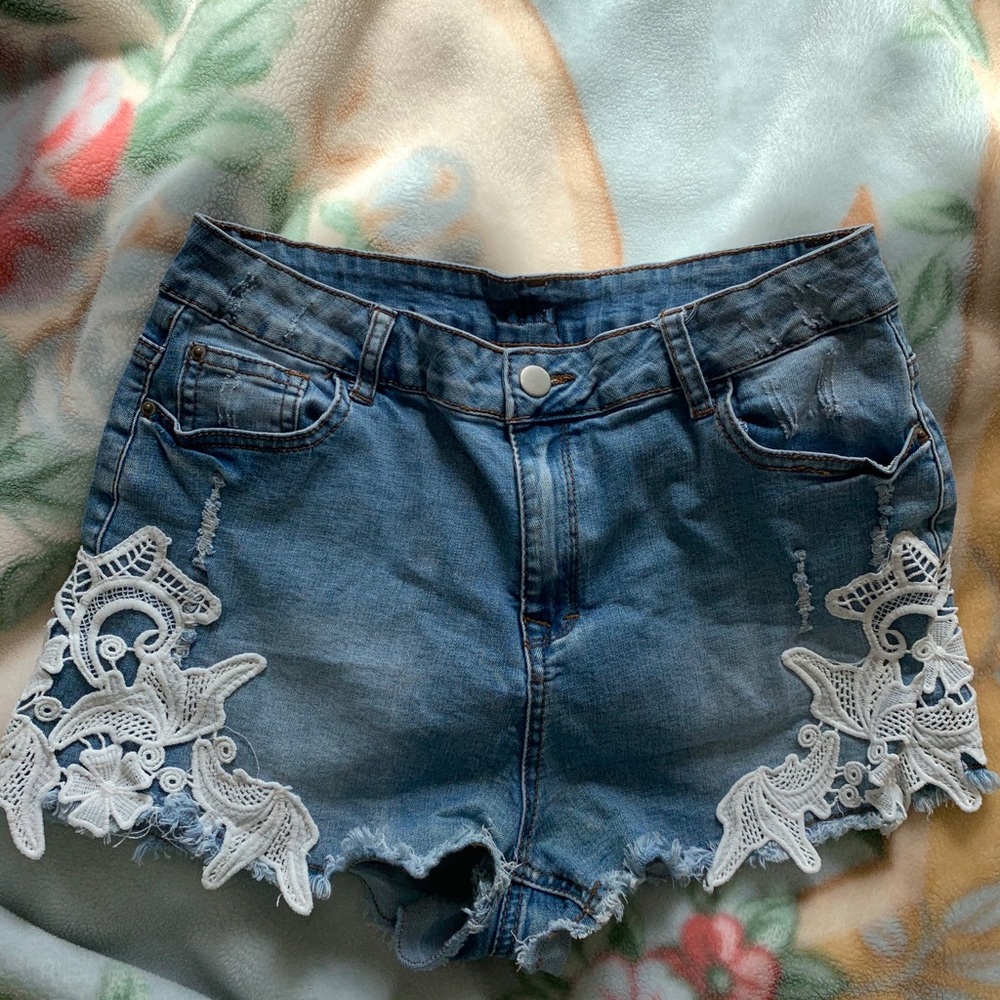 Floral lace denim shorts